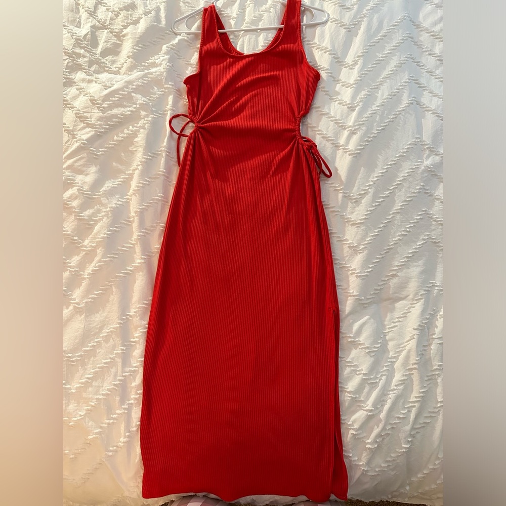Red maxi dress with cutouts at either side of the midsection